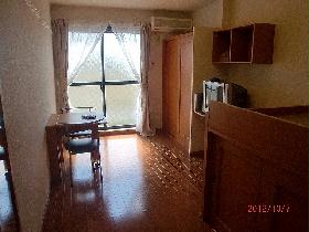 Living and room. It is a photograph of the same type of room.